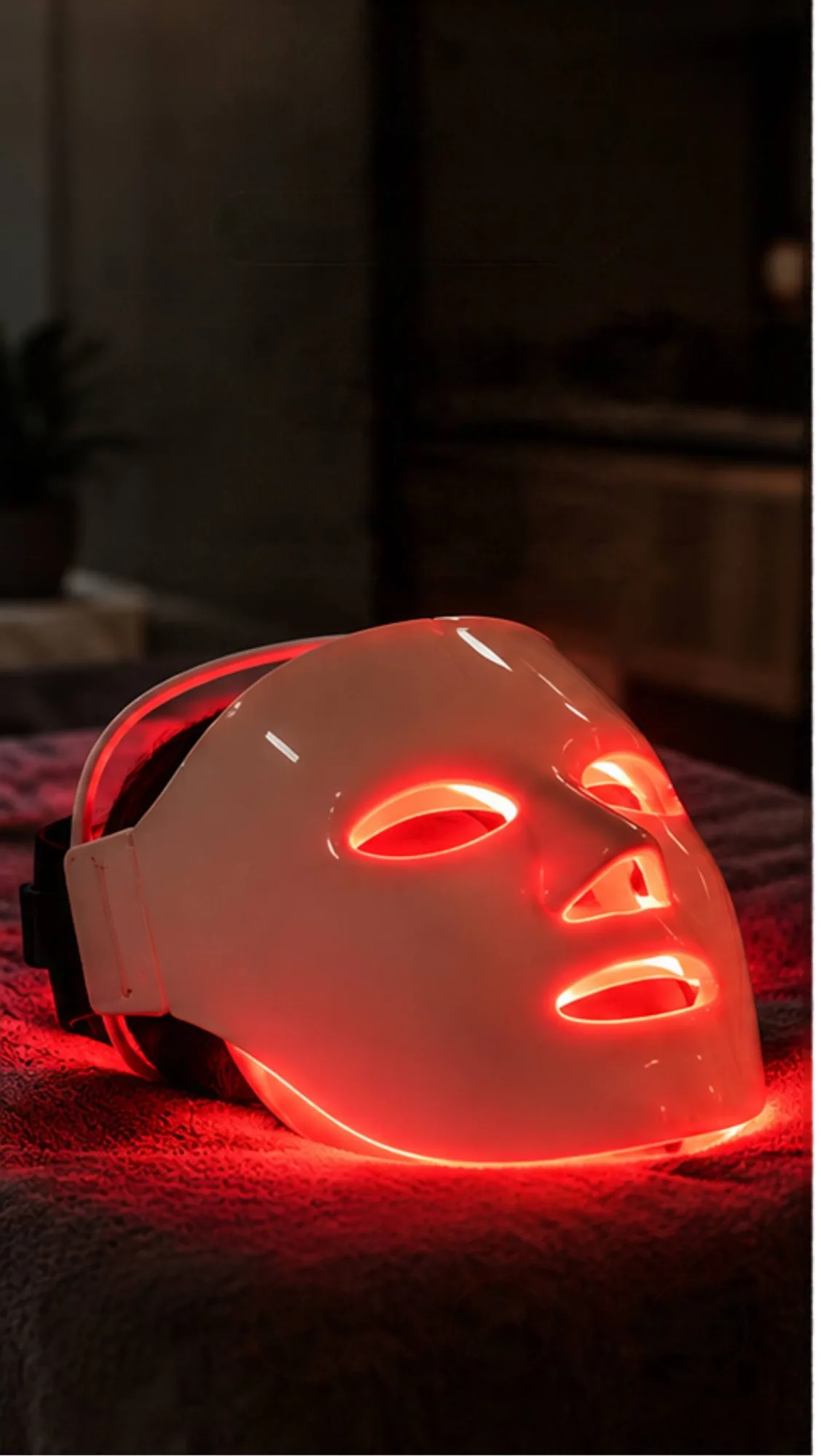 Illuminated facial LED mask ready for a Face Red Light Therapy session