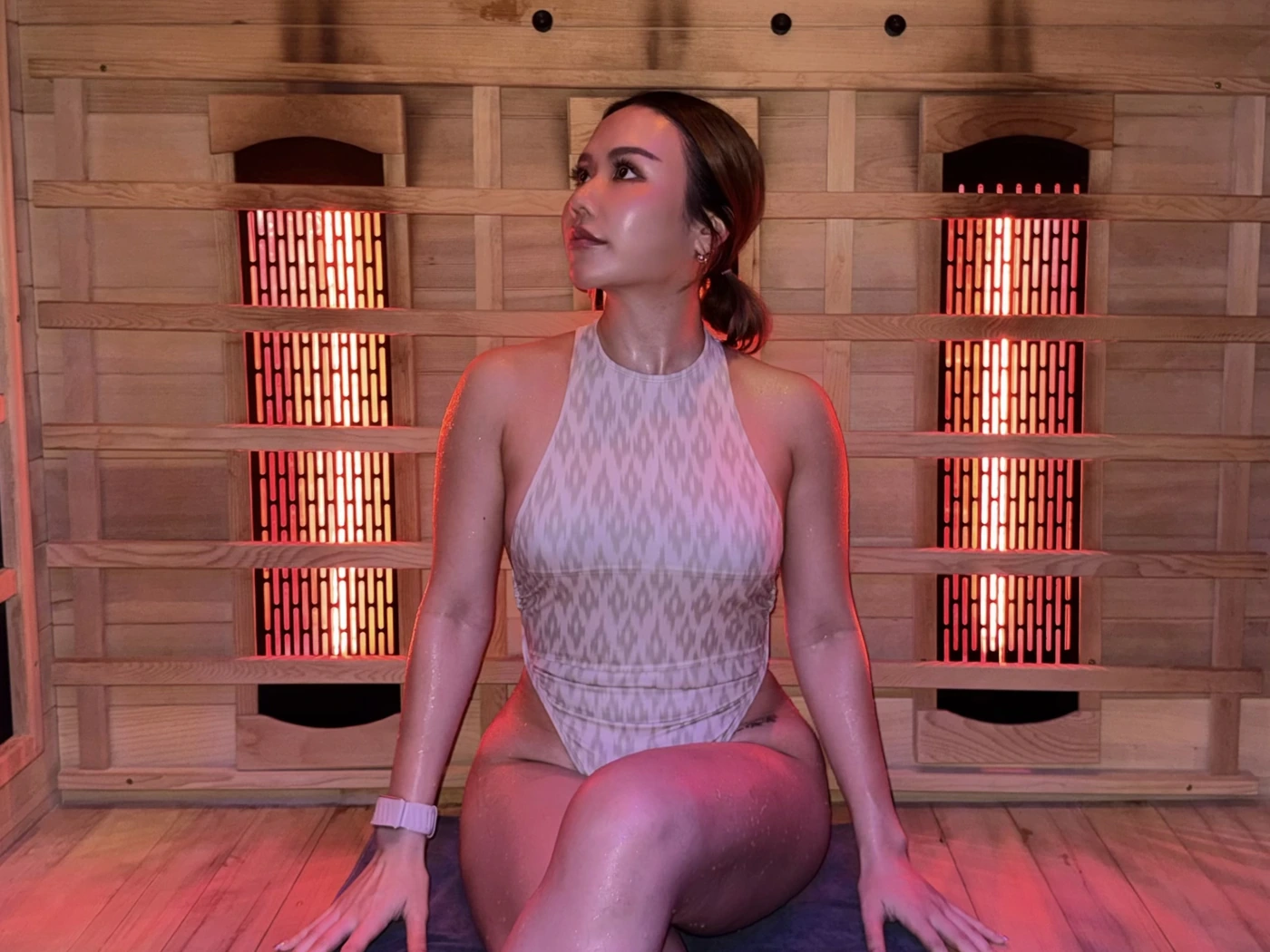 Woman relaxing in the private infrared sauna at Fast & Fit