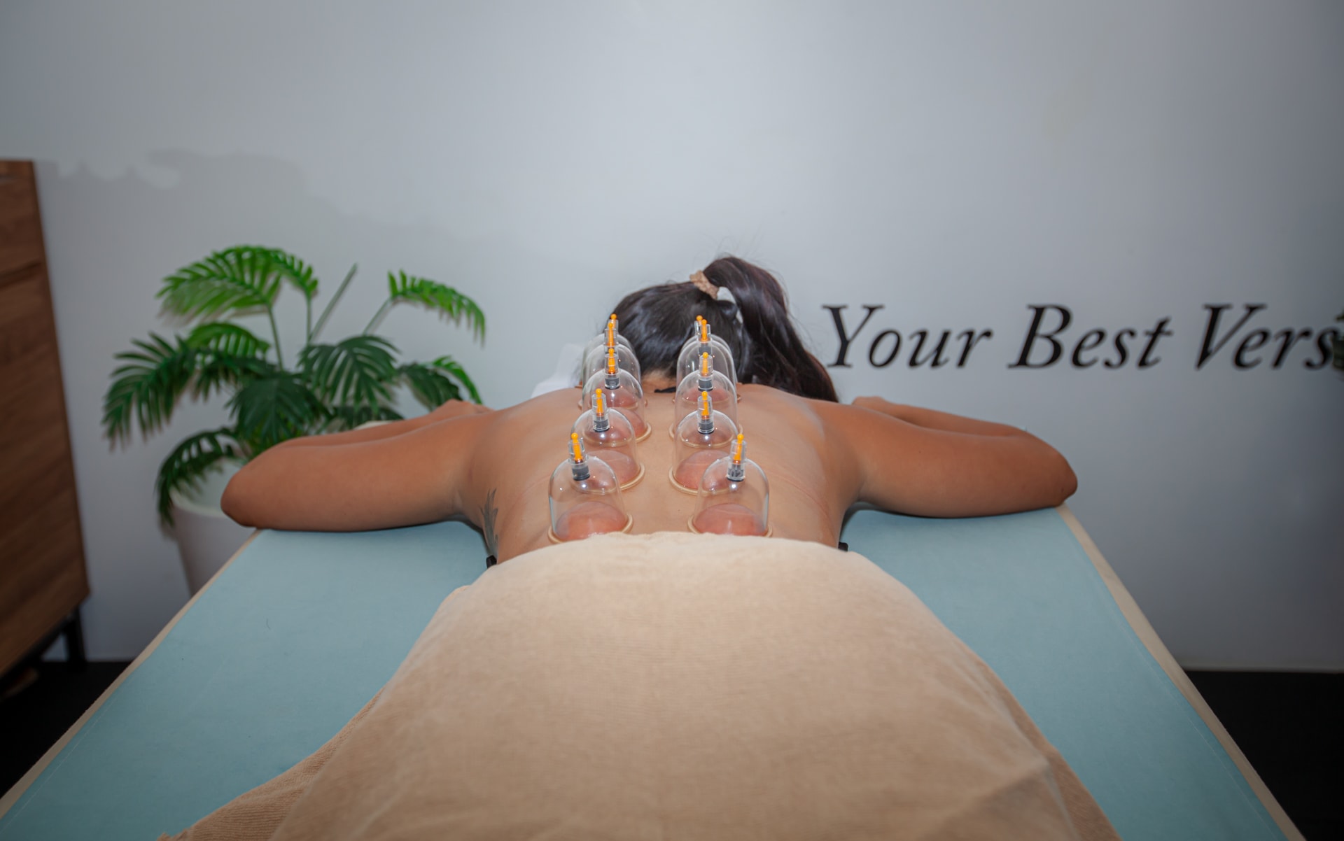 A woman in a massage bed