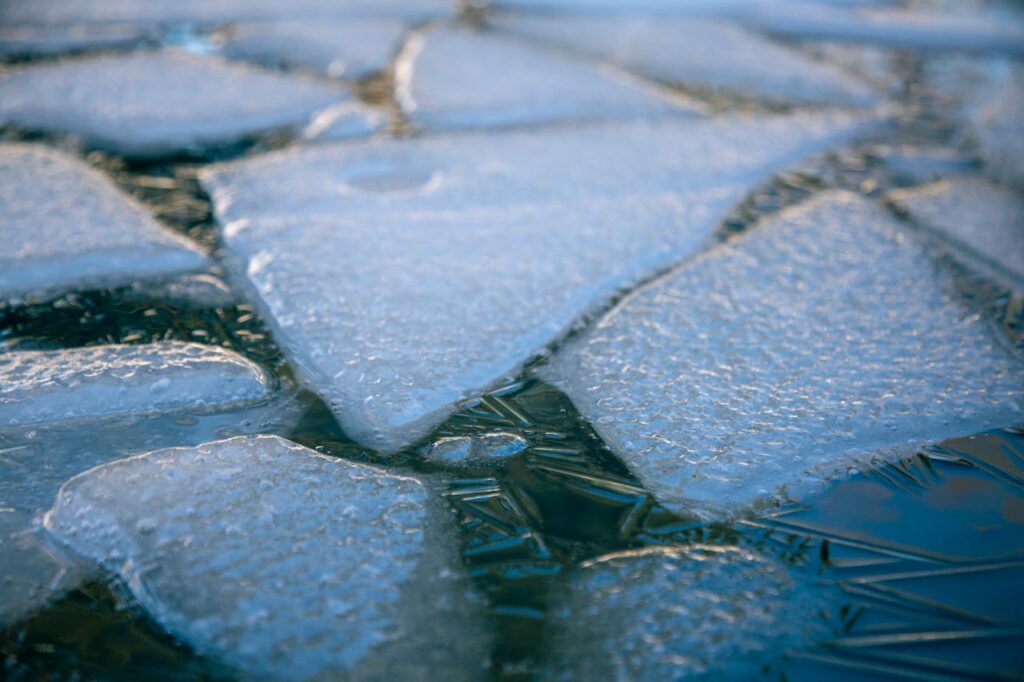 A close up photo of ice and water